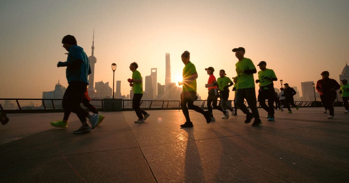 Early morning outdoor training session in Dubai with sunrise visible over the skyline